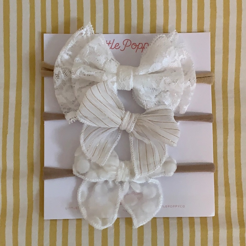 Assorted white infant bows